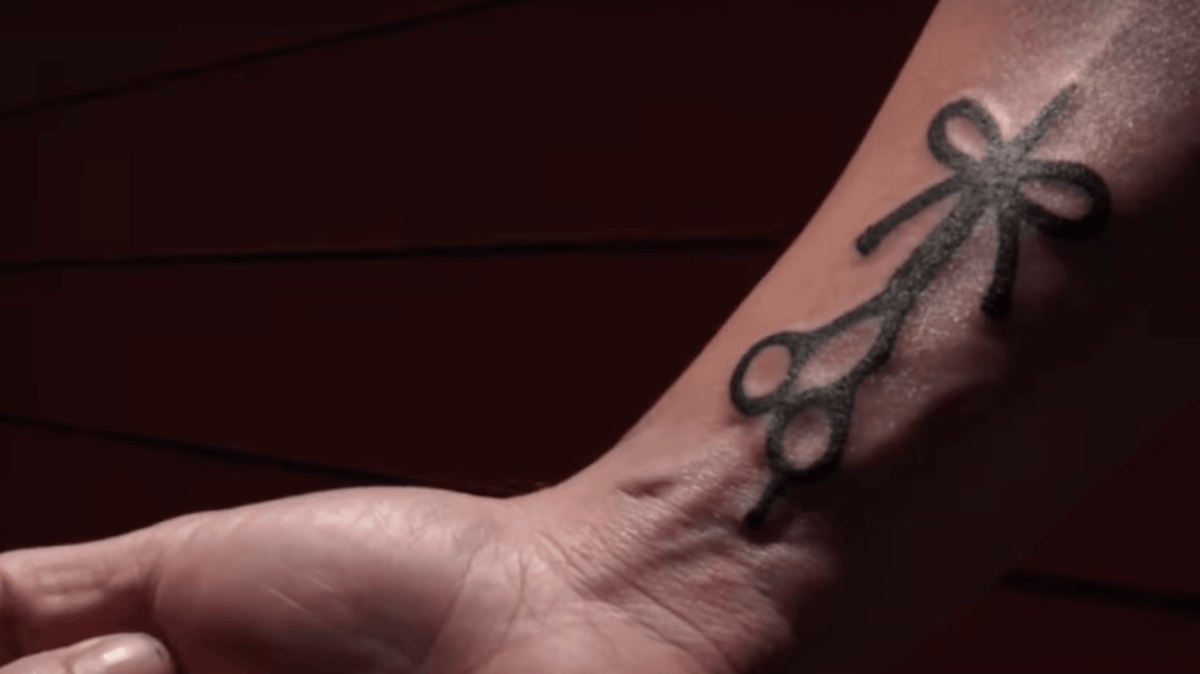 The Longhairs squad shows off their new tattoos in front of Bear Cat Tattoo Gallery Headquarters
