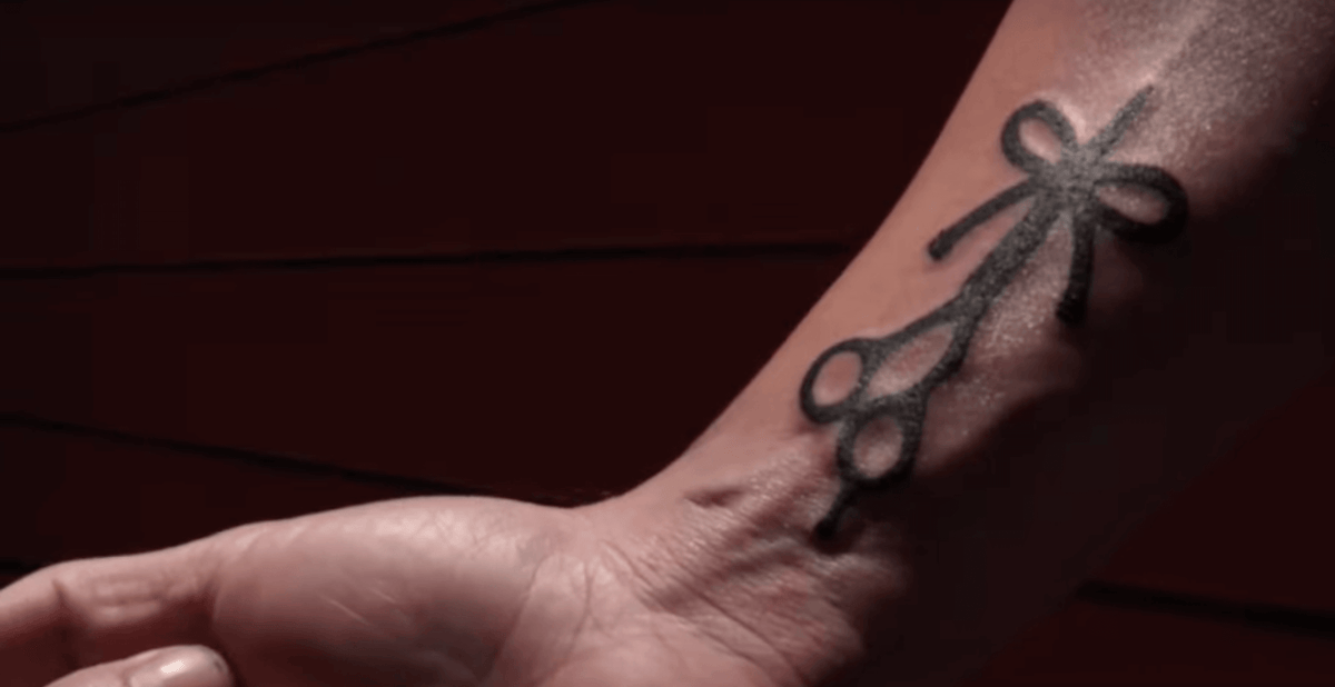 The Longhairs squad shows off their new tattoos in front of Bear Cat Tattoo Gallery Headquarters